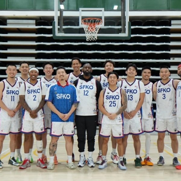 The San Francisco squad in white and blue SFKO jerseys, lined up in an empty arena.